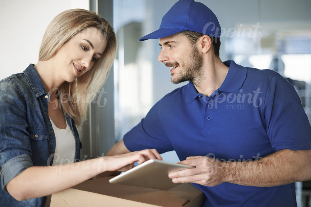 Woman receiving delivery at front door