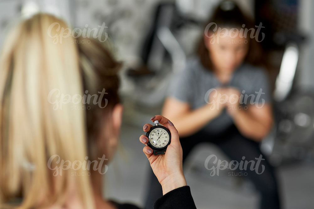 Close up of fitness instructor checking the time
