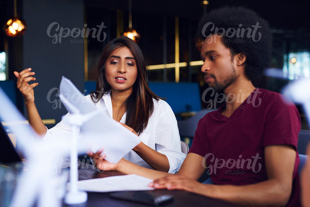 Business couple analyzing the documents at work