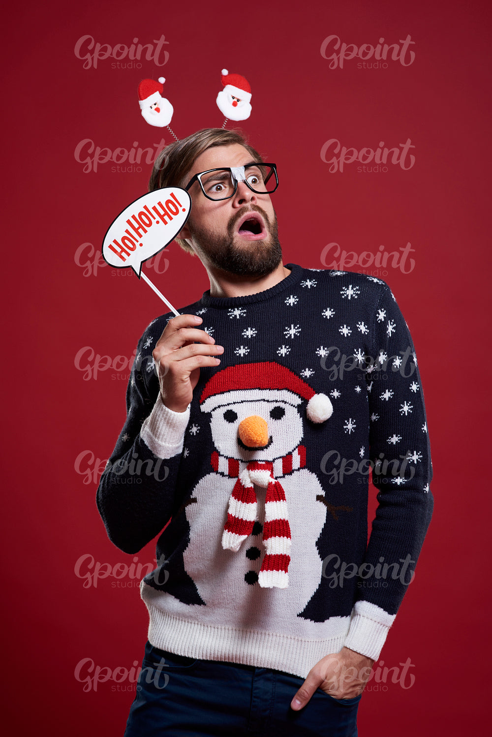 Man holding a Christmas mask
