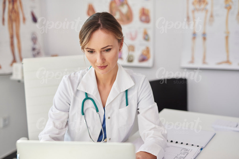 Female doctor working with technology in doctor’s office