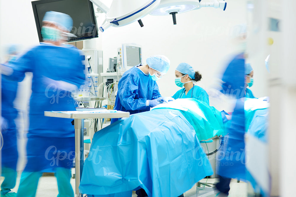 Surgeon team working together while operation