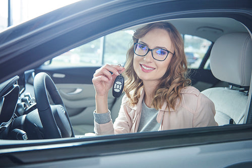 Attractive business woman with car keys