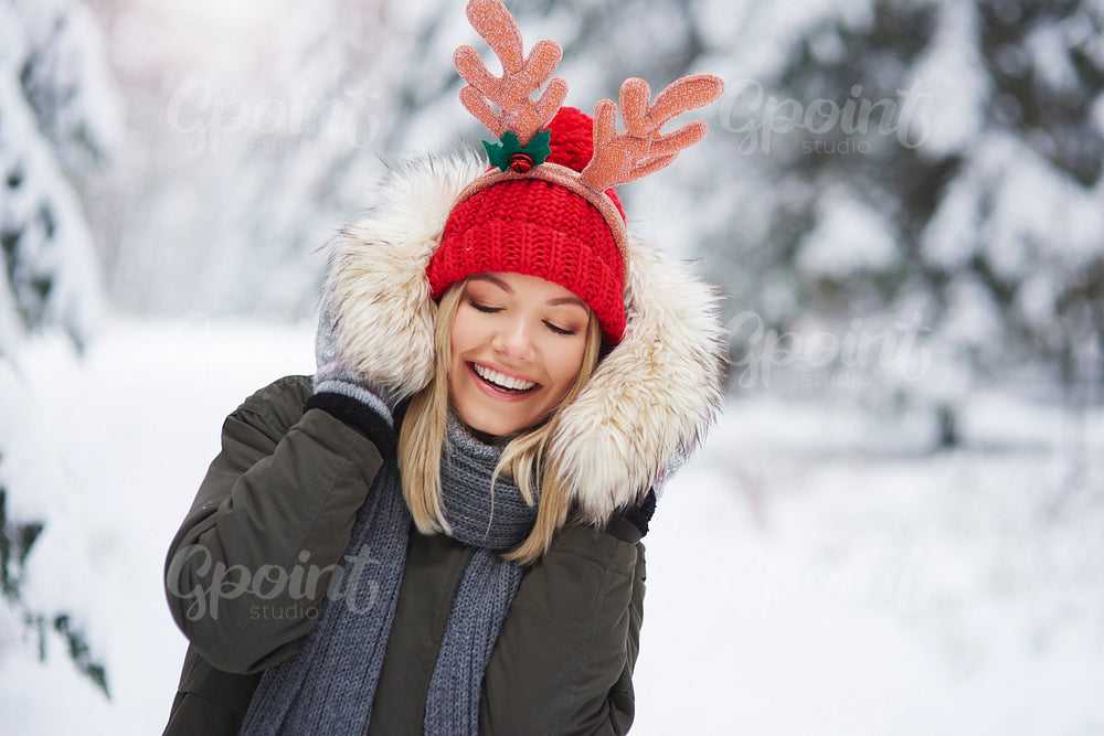 Young woman have fun with winter clothes