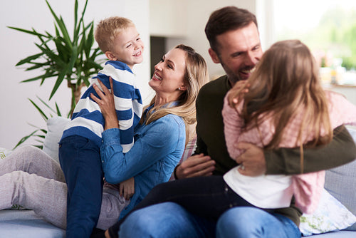 Cheerful family enjoying together at home