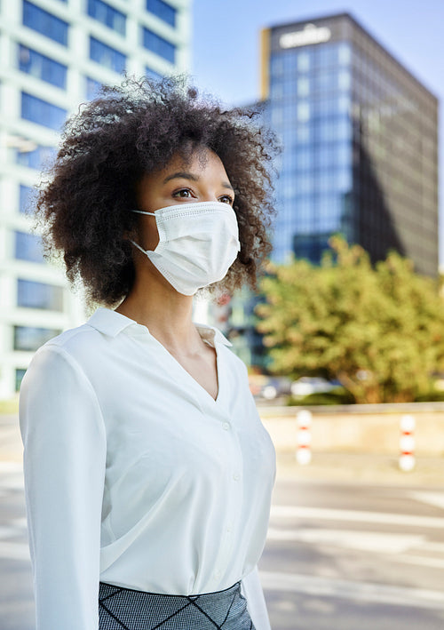 Woman  in protective face mask on the street