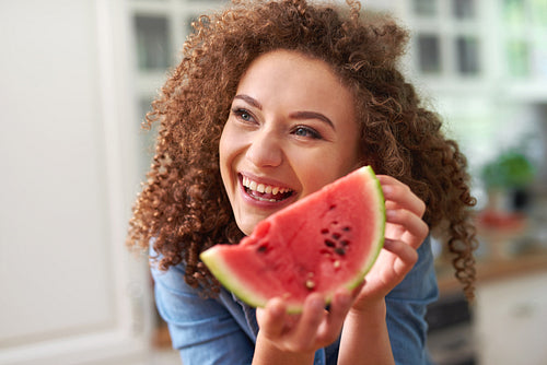 Woman with a slice of watermelon