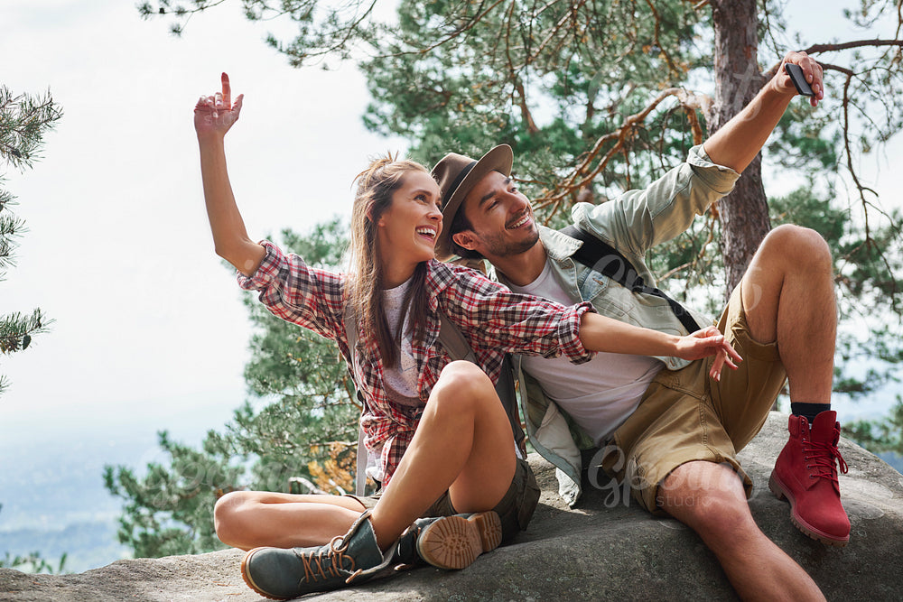Couple making a selfie during hiking trip