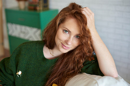 Portrait of smiling, red haired girl with freckles