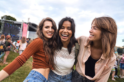 Group of multiracial friends have fun at music festival