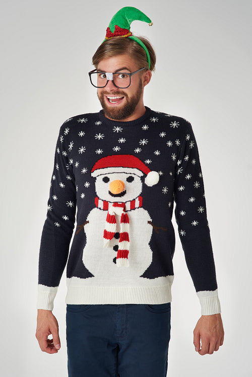 Cheerful man and jumper with a snowman