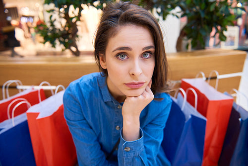 Worried woman spent all her money during shopping