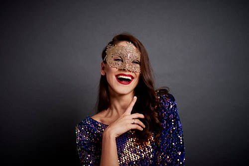 Portrait of glamorous woman in mask