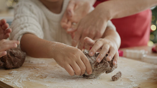 Handheld video of children preparing cookies with gingerbread pastry