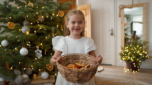 Portrait of cute girl with natural Christmas decorations