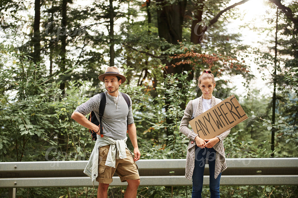Portrait of young couple backpacking
