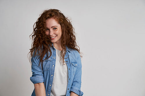 Beautiful young woman with curly hair