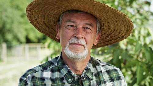 Close up video portrait of farmer in a straw hat