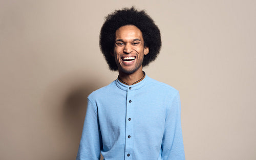 Portrait of happy mixed race man