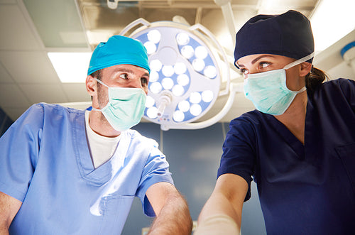 Two surgeons standing face to face