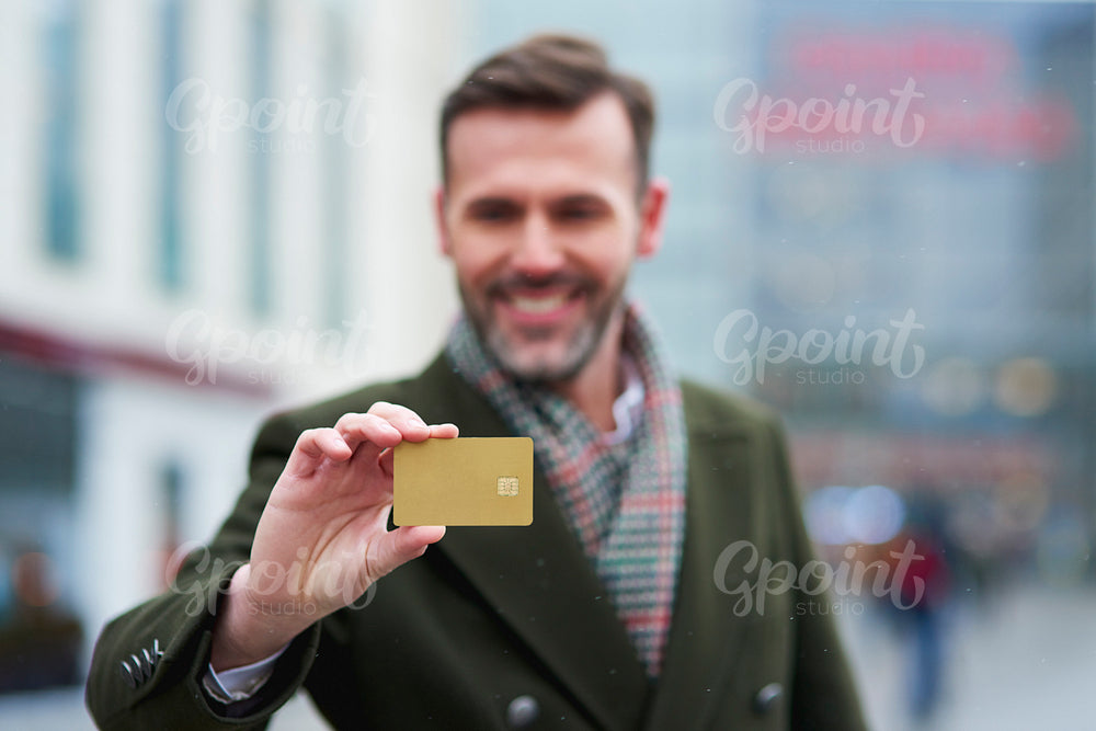 Man with credit card during big shopping