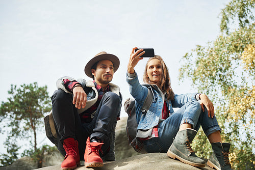 Happy couple making a selfie during hiking trip