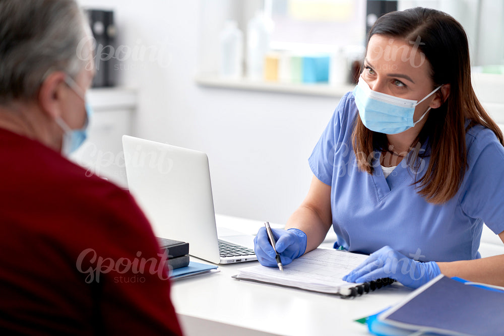 Female doctor conducts a medical interview with the senior