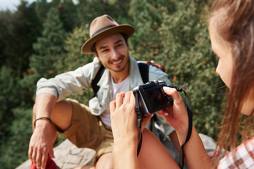Backpackers using technology during hiking trip