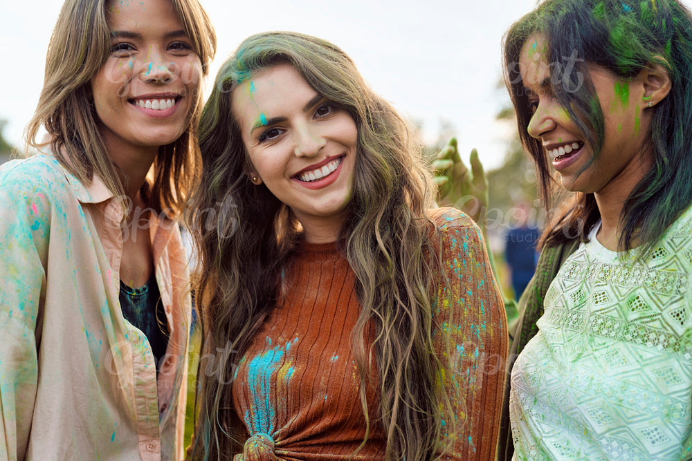 Group of friends playing at Holi Festival  