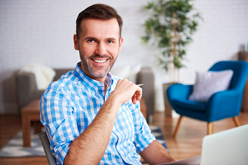 Portrait of confident man in home office