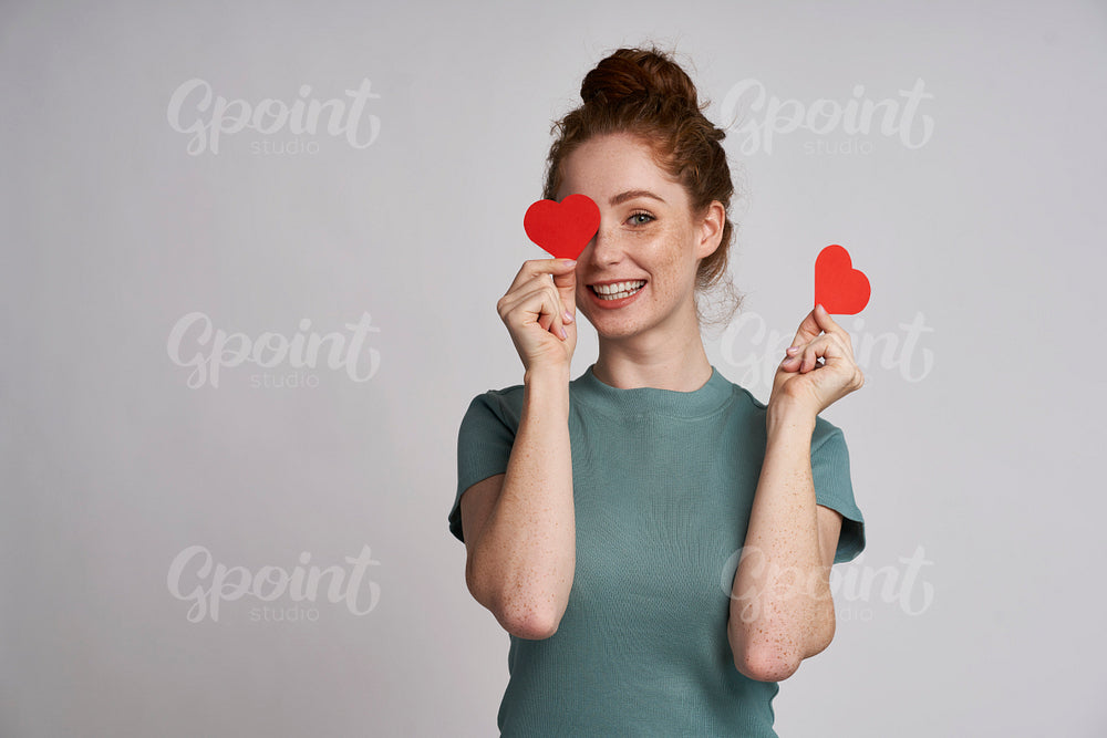 Happy woman with hearts on eyes