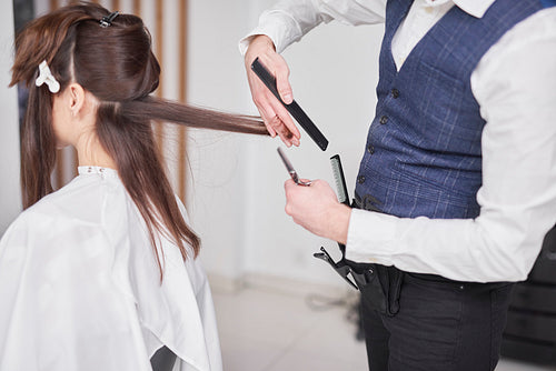Young woman has cutting hair at the hairdresser