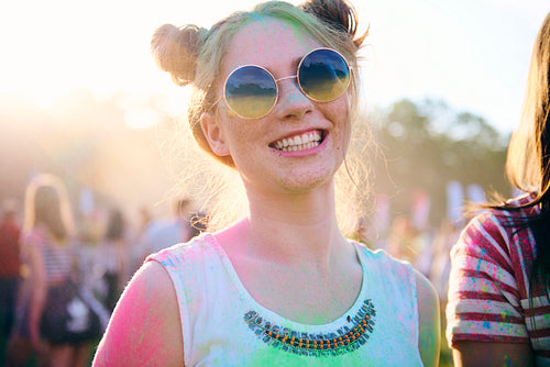 Portrait of colorful woman during music festival