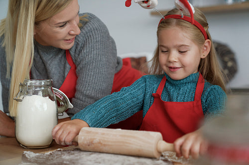 Mother and daughter spending time together on baking