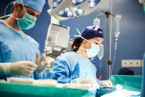 Two surgeons working together in operating room