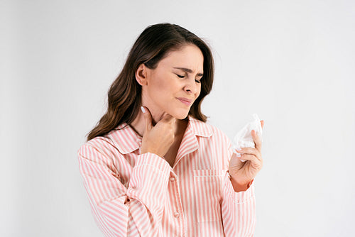 Young woman suffering from sore throat