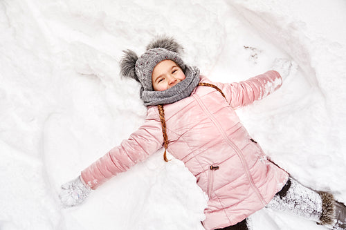 Girl making a snow angel