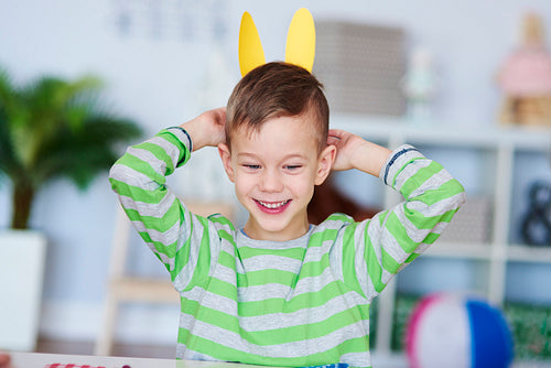 Playful boy with bunny ears