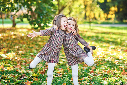 Twin girls embracing each other