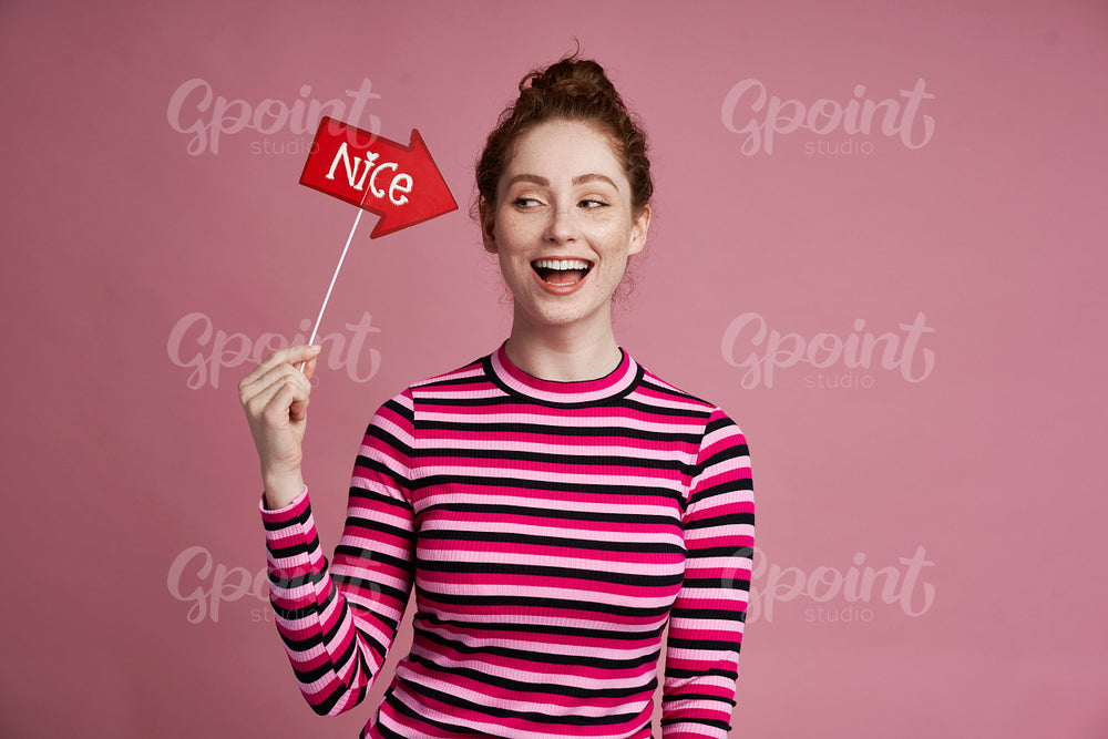 Studio shot of smiling young girl on the pink background 