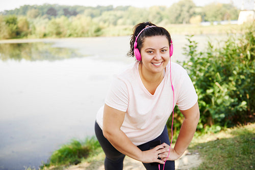 Portrait of smiling woman exercising outdoors