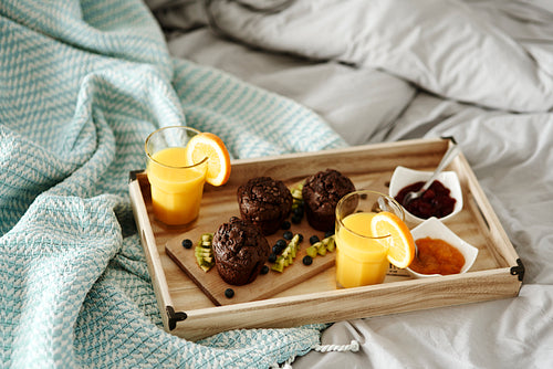 Delicious breakfast on a tray in bedroom