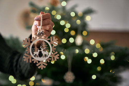 Close up of woman's hand with Christmas decoration