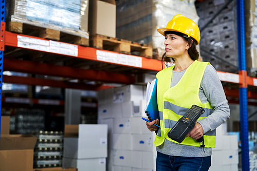 Adult caucasian woman working in warehouse