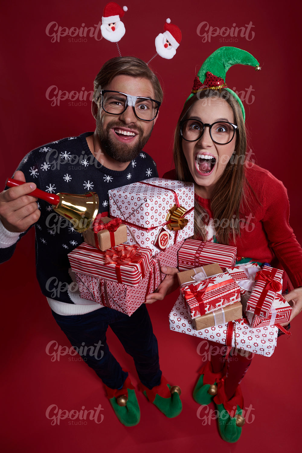 Pile of gifts held by couple