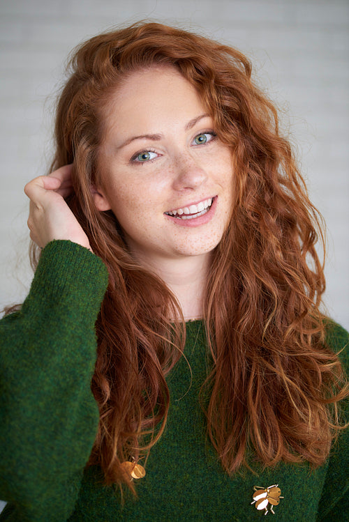 Portrait of red haired woman with freckles