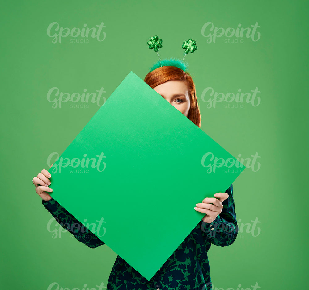 Woman's hands holding banner with copy space in studio shot