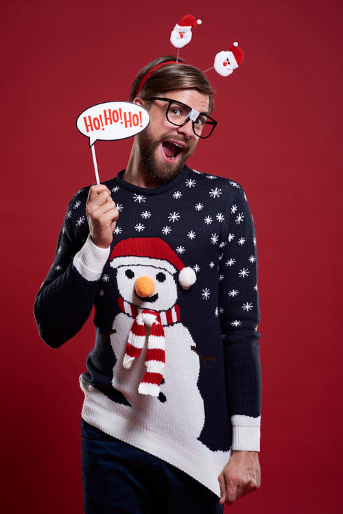Man in funny sweater and Christmas mask