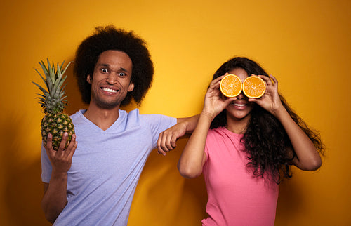 Horizontal image of couple with exotic fruits