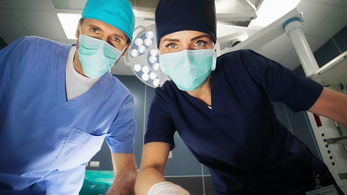 Doctors checking patient at operating room
